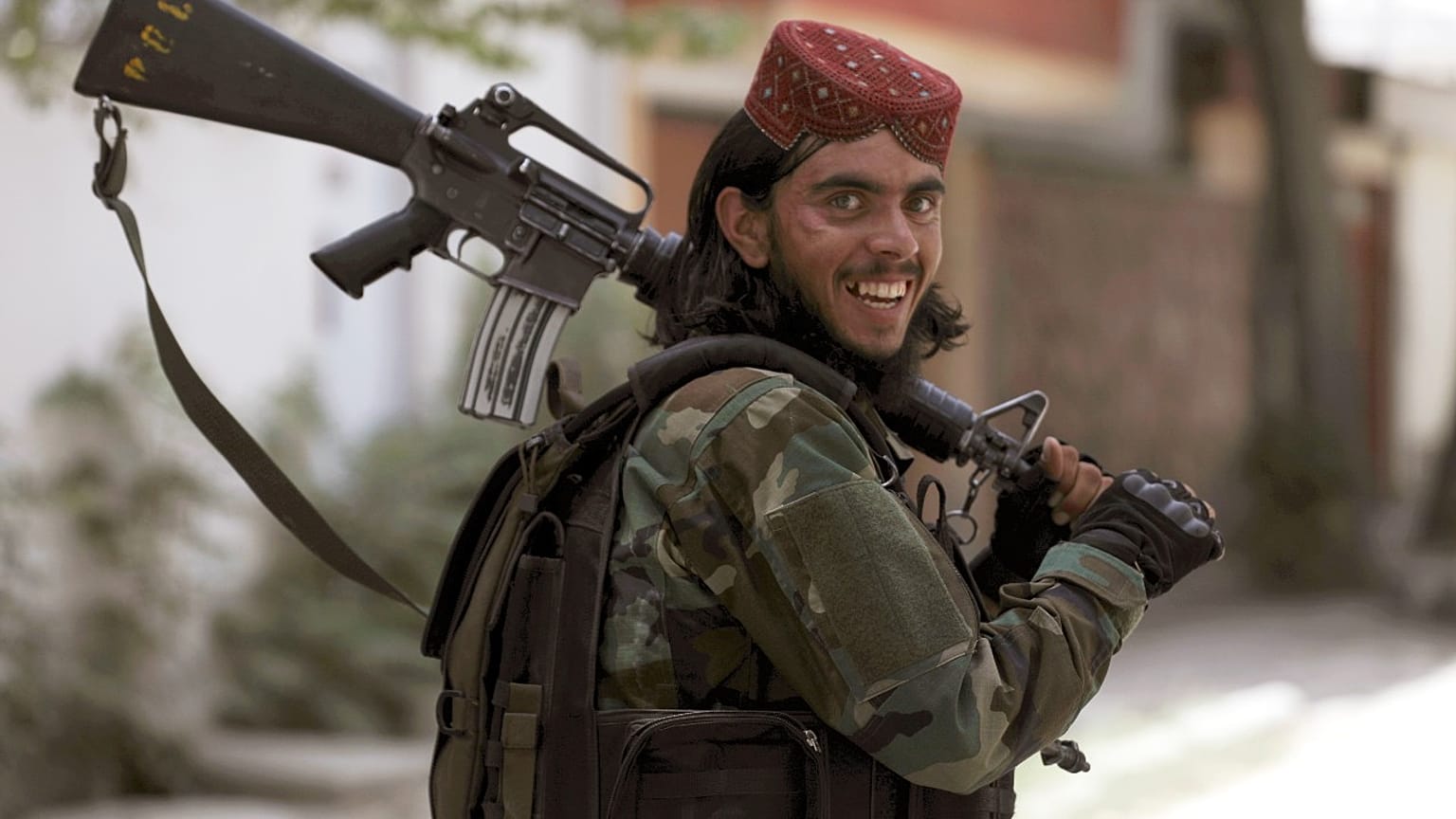 A Taliban fighter patrols in Wazir Akbar Khan in the city of Kabul, Afghanistan, Wednesday, Aug. 18, 2021
