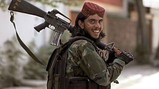 A Taliban fighter patrols in Wazir Akbar Khan in the city of Kabul, Afghanistan, Wednesday, Aug. 18, 2021
