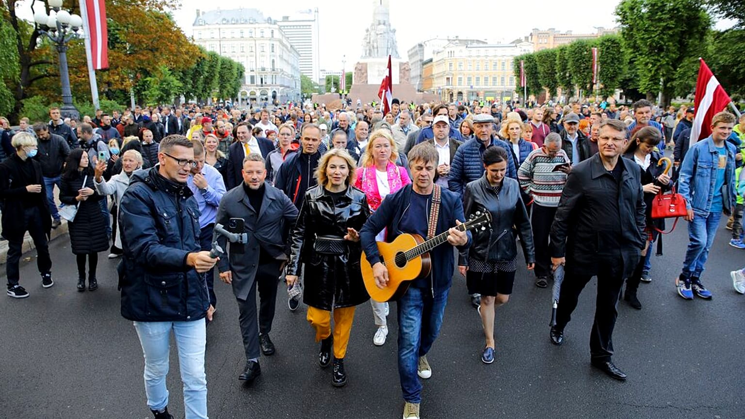 Protesters march during a protest against mandatory vaccinations, in Riga, Latvia