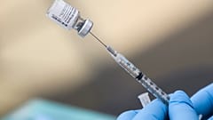 In this file photo a syringe is filled with a first dose of the Pfizer Covid-19 vaccine at a mobile vaccination clinic at the Weingart East Los Angeles YMCA in Los Angeles
