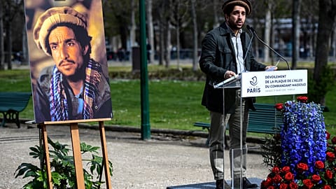 Ahmad Massoud, son of late Afghan commander Ahmad Shah Massoud delivers a speech next to a portait of his father 