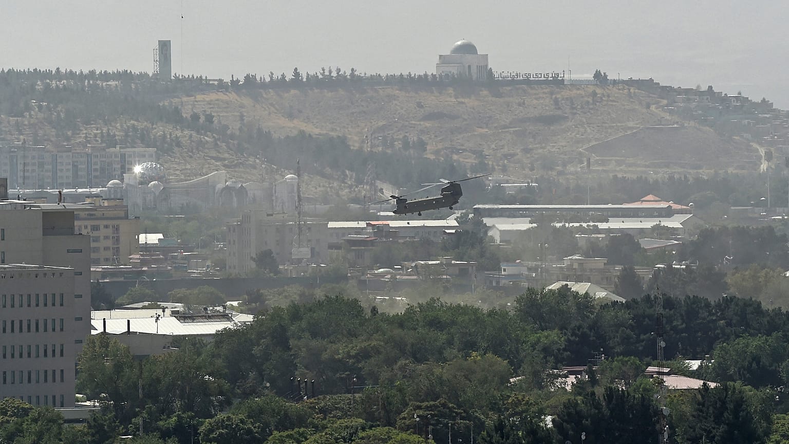 FILE-A US military helicopter is pictured flying above the US embassy in Kabul on August 15, 2021. 