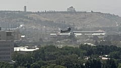 FILE-A US military helicopter is pictured flying above the US embassy in Kabul on August 15, 2021. 