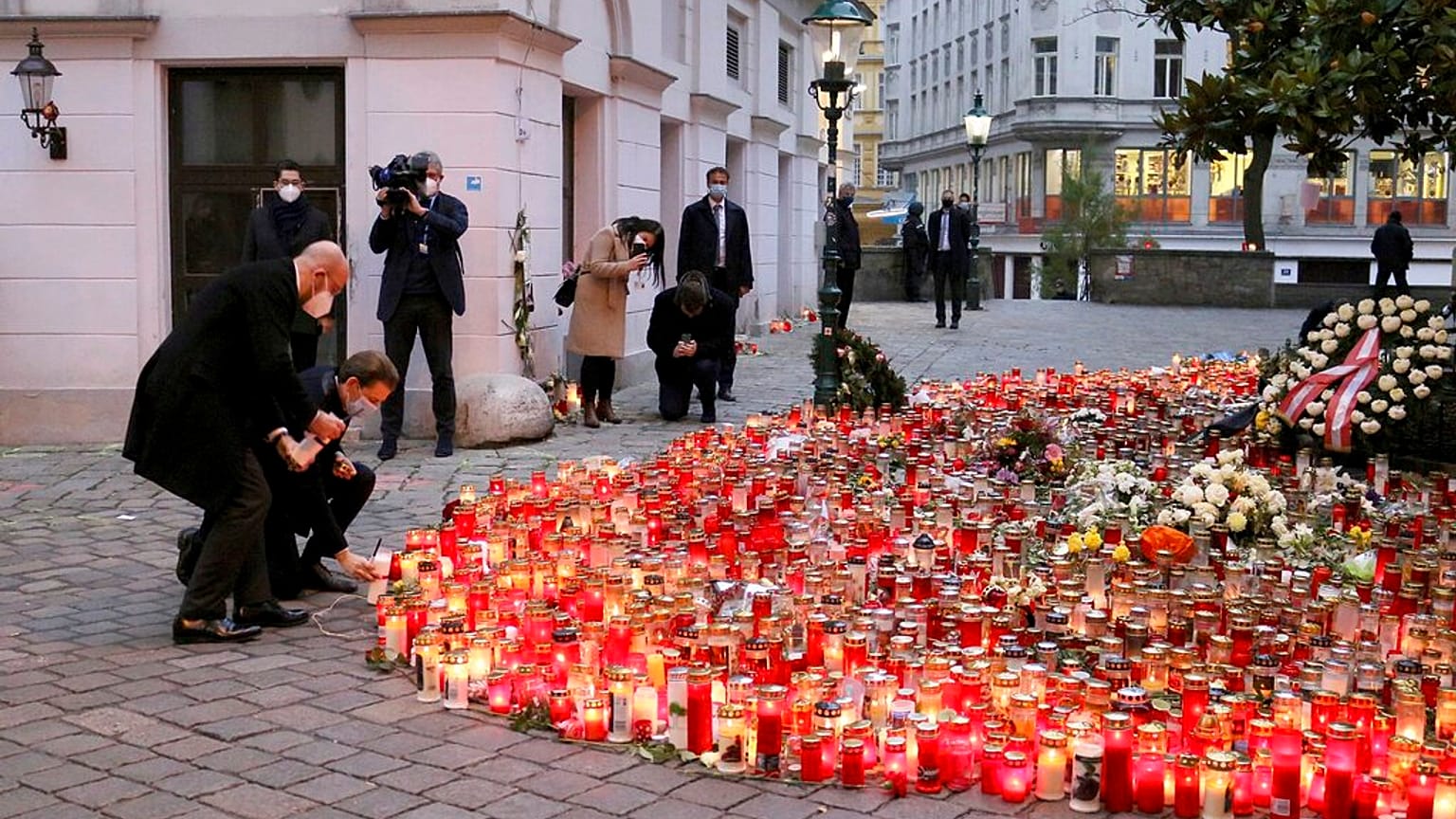 President of the European Council Charles Michel with Austrian Chancellor Sebastian Kurz, right, place tributes to those killed in Vienna's terror attack