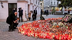 President of the European Council Charles Michel with Austrian Chancellor Sebastian Kurz, right, place tributes to those killed in Vienna's terror attack