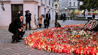 President of the European Council Charles Michel with Austrian Chancellor Sebastian Kurz, right, place tributes to those killed in Vienna's terror attack