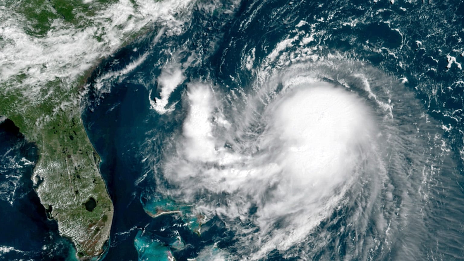 This OES-16 East GeoColor satellite image taken Friday, Aug. 20, 2021, at 11:40 a.m. EDT., and provided by NOAA, shows Tropical Storm Henri in the Atlantic Ocean