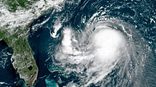 This OES-16 East GeoColor satellite image taken Friday, Aug. 20, 2021, at 11:40 a.m. EDT., and provided by NOAA, shows Tropical Storm Henri in the Atlantic Ocean