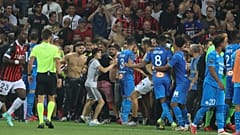 Fans invade the pitch during the French L1 football match between OGC Nice and Olympique de Marseille (OM) at the Allianz Riviera stadium in Nice, France on August 22, 2021.