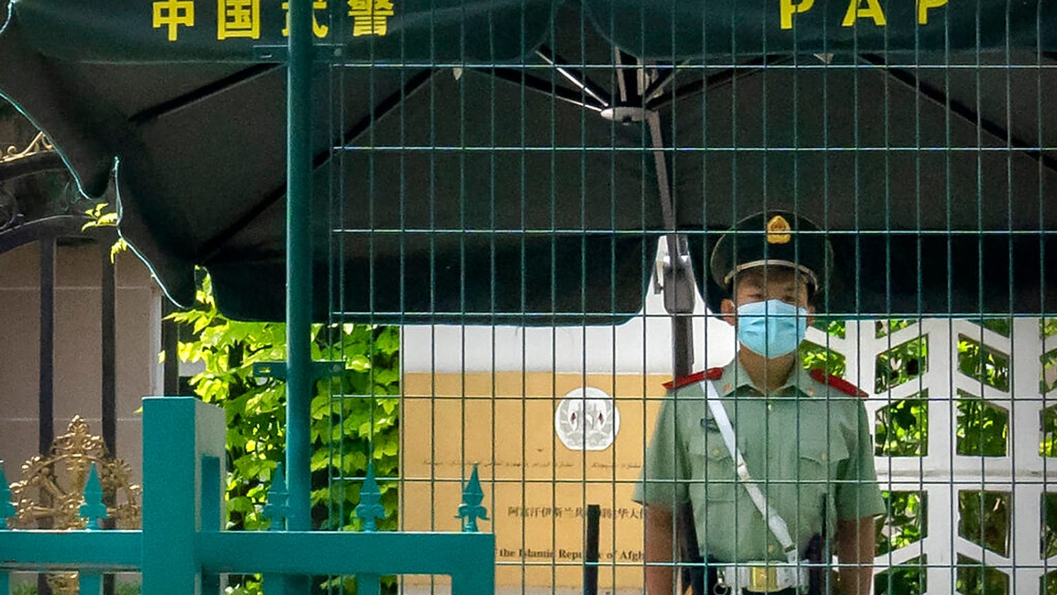 A Chinese paramilitary policeman stands guard outside the Afghanistan Embassy in Beijing, on Aug. 20, 2021