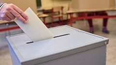 A voter casts their ballot in a polling station in Neustadt am Ruebenberge, Germany, in October 2017.