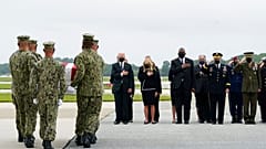 President Joe Biden watches as a Navy carry team moves a transfer case containing the remains of Navy Corpsman Maxton W. Soviak, 22, of Berlin Heights, Ohio, Sunday, Aug. 29.