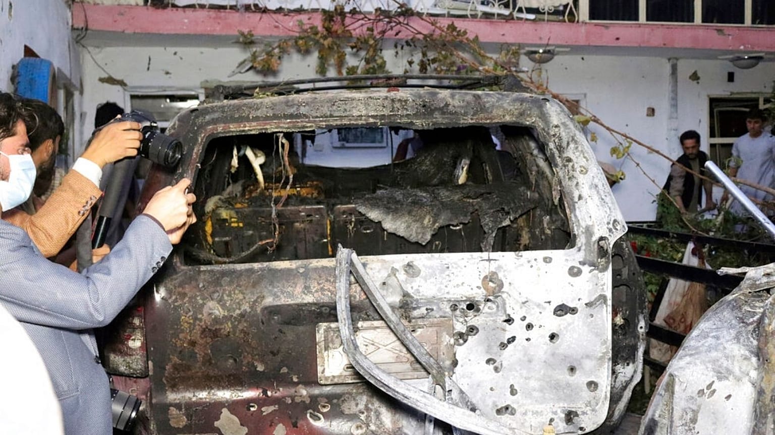 destroyed vehicle inside a house after U.S. drone strike in Kabul, Afghanistan, Sunday, Aug. 29, 2021
