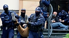 Police removed protestors from outside the Constitutional Tribunal building in Warsaw.