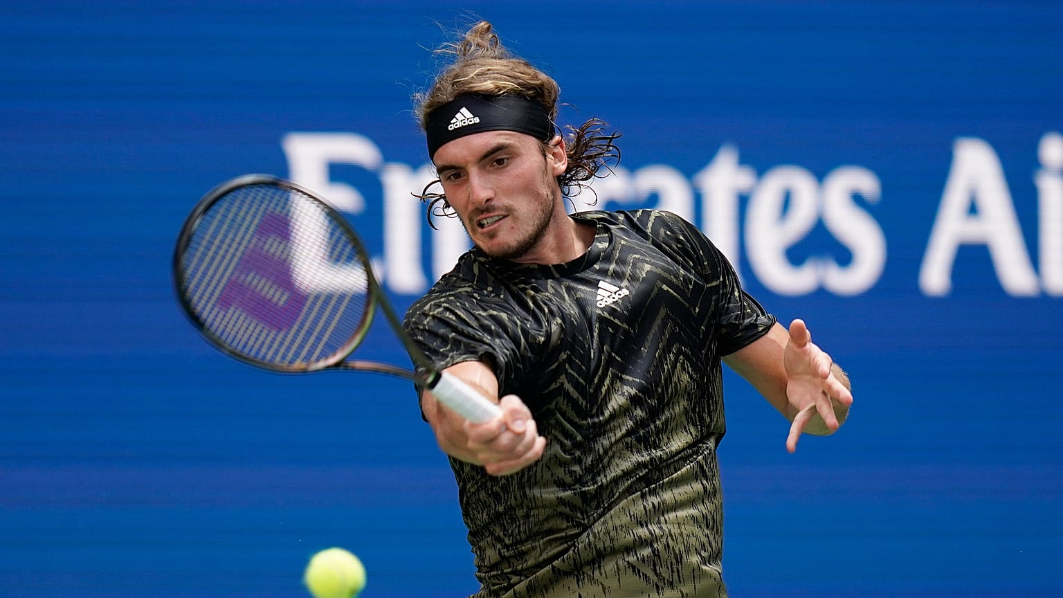 Stefanos Tsitsipas, of Greece, returns a shot to Andy Murray