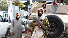 Taliban fighters stand guard in front of the Hamid Karzai International Airport after the U.S. withdrawal in Kabul, Afghanistan, Tuesday, Aug. 31, 2021. 