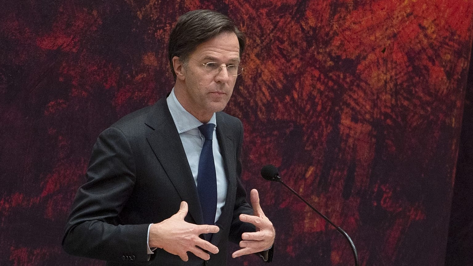 Caretaker Dutch Prime Minister Mark Rutte apologizes to other party leaders during a debate in parliament in The Hague, Netherlands, April 2, 2021.