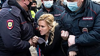 Police officers detain the Alliance of Doctors union's leader Anastasia Vasilyeva at the prison colony IK-2