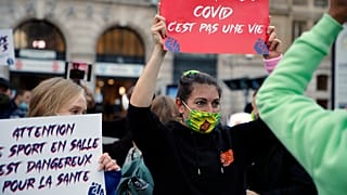 People protest against the closing of bars and indoor sports facilities in Paris, Oct. 13, 2020. 