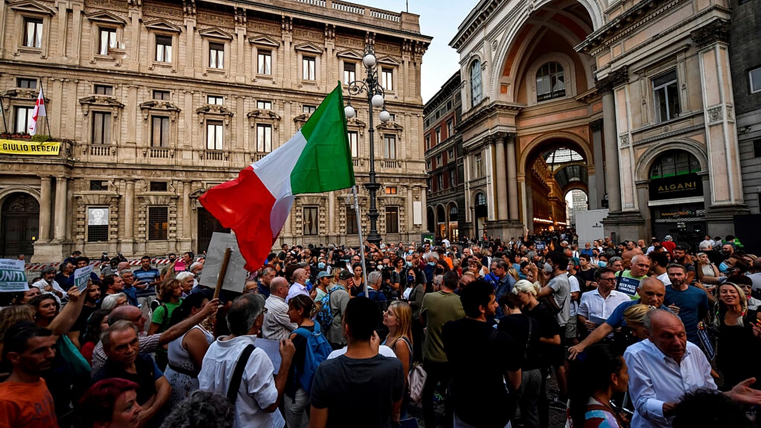 People stage a protest against the COVID-19 vaccination pass in Milan, Italy, Wednesday, July 28, 2021.