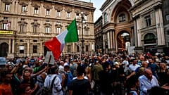 People stage a protest against the COVID-19 vaccination pass in Milan, Italy, Wednesday, July 28, 2021.