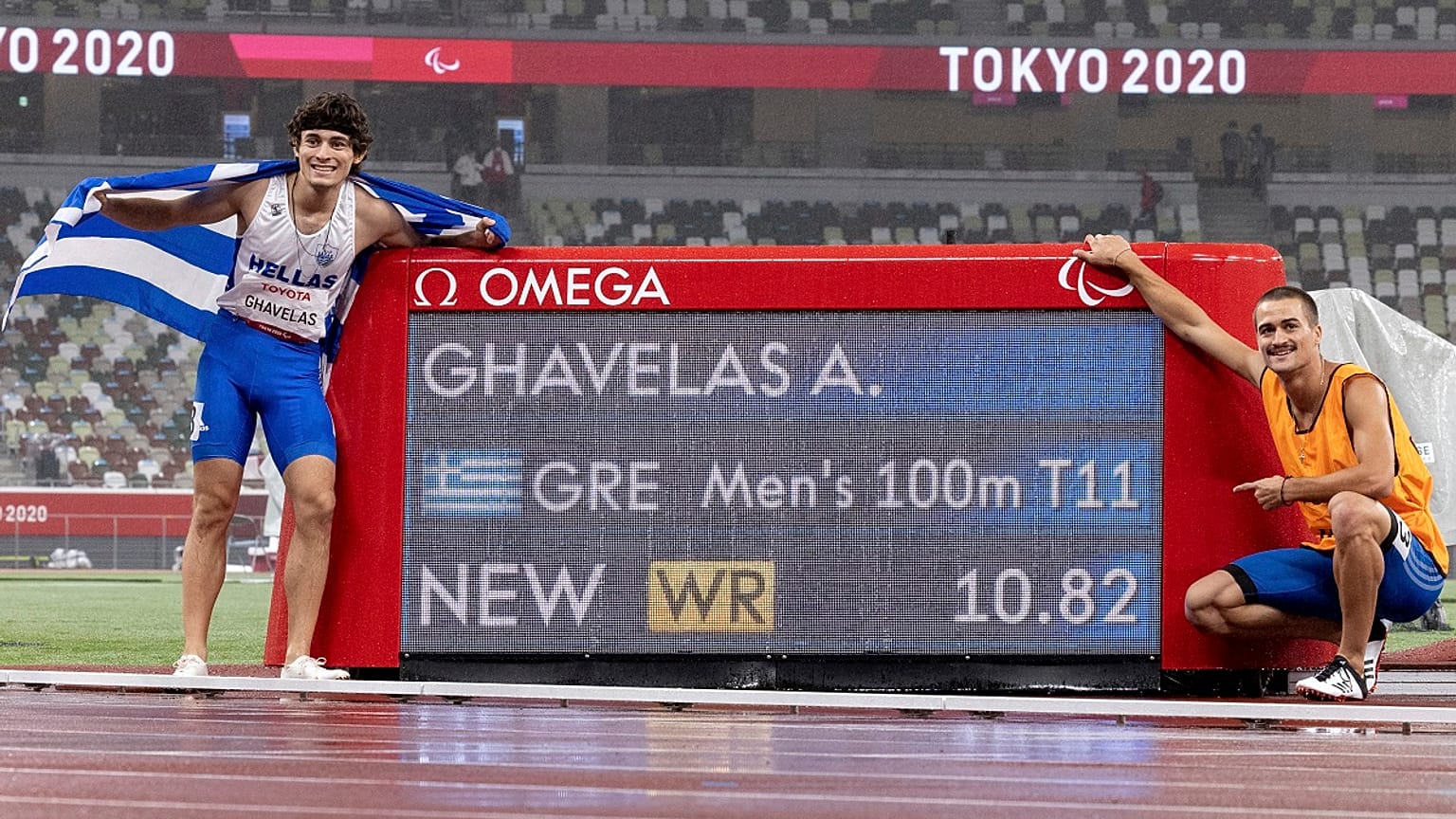 Athanasios Ghavelas of Greece and his guide Sotirios Gkaragkanis celebrate their world record 