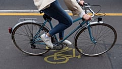 A woman cycles in a so-called pop-up cycling lane in Berlin on June 11, 2020