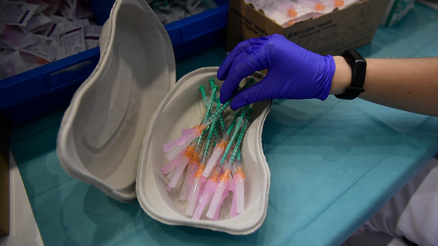 A health worker prepares Pfizer vaccines during the national COVID-19 vaccination campaign in Pamplona, northern Spain.