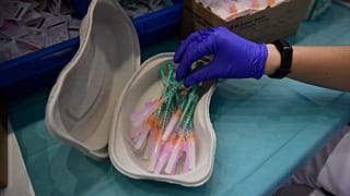 A health worker prepares Pfizer vaccines during the national COVID-19 vaccination campaign in Pamplona, northern Spain.