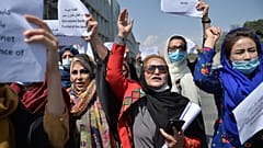 Afghan women take part in a protest march for their rights under the Taliban rule