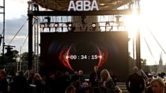 People look at the screen, at the ABBA Voyage event at Grona Lund, in Stockholm, Sweden, Sept. 2, 2021. 