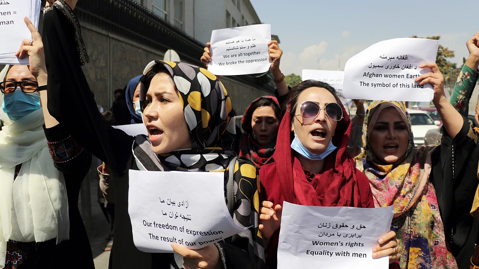 Women gather to demand their rights under the Taliban rule during a protest in Kabul