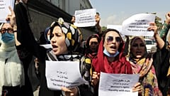 Women gather to demand their rights under the Taliban rule during a protest in Kabul