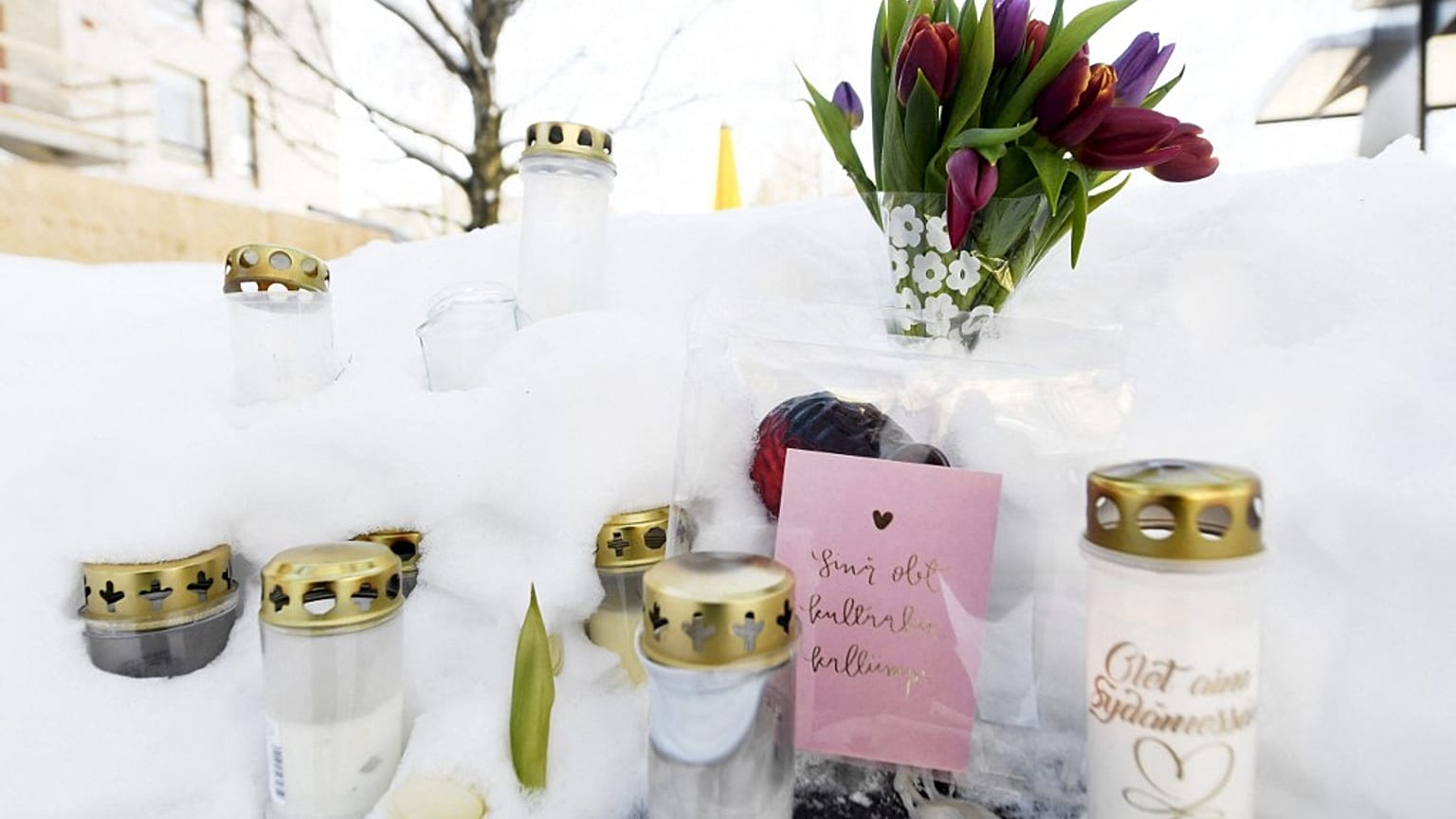 Candles, flowers and notes are placed in a park where the 16-year-old boy died.