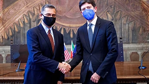 US health secretary Secretary Xavier Becerra shakes hands with his Italian counterpart Roberto Speranza in Rome on 5 September 2021