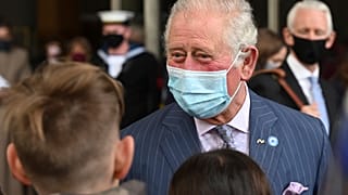 Britain's Prince Charles meets school children during a visit to Coventry Cathedral in Coventry, central England, May 25, 2021. 
