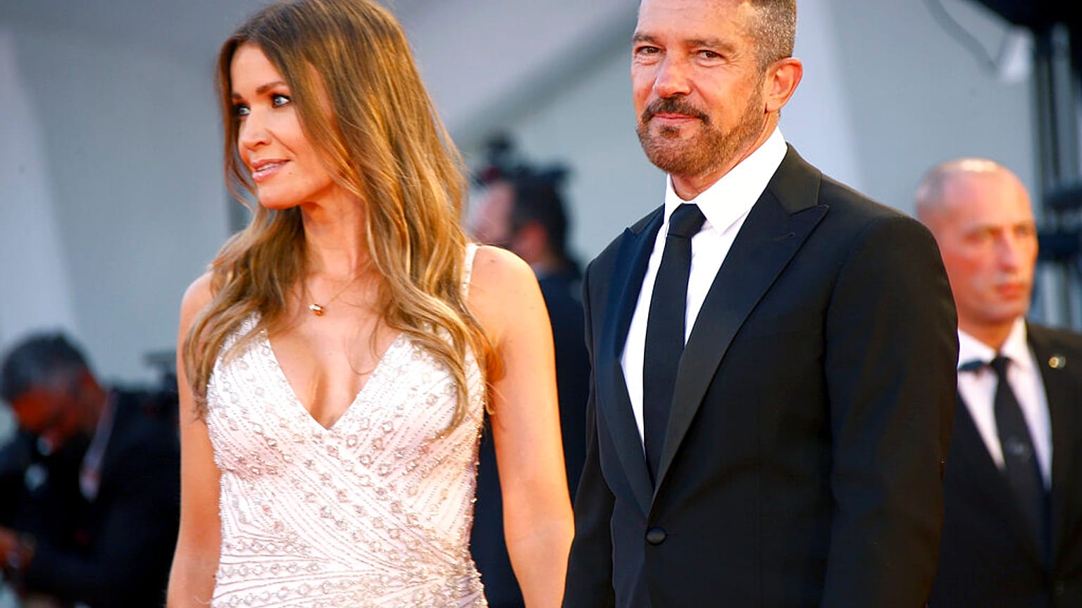 Antonio Banderas, right, and Nicole Kimpel pose for photograph upon arrival at the premiere of the film 'Official Competition' during the 78th Venice Film Festival.