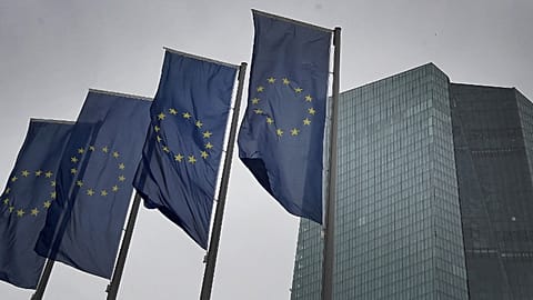 Flags of the European Union flutter in front of the headquarters of the European Central Bank (ECB) in Frankfurt am Main, western Germany, on March 12, 2020.