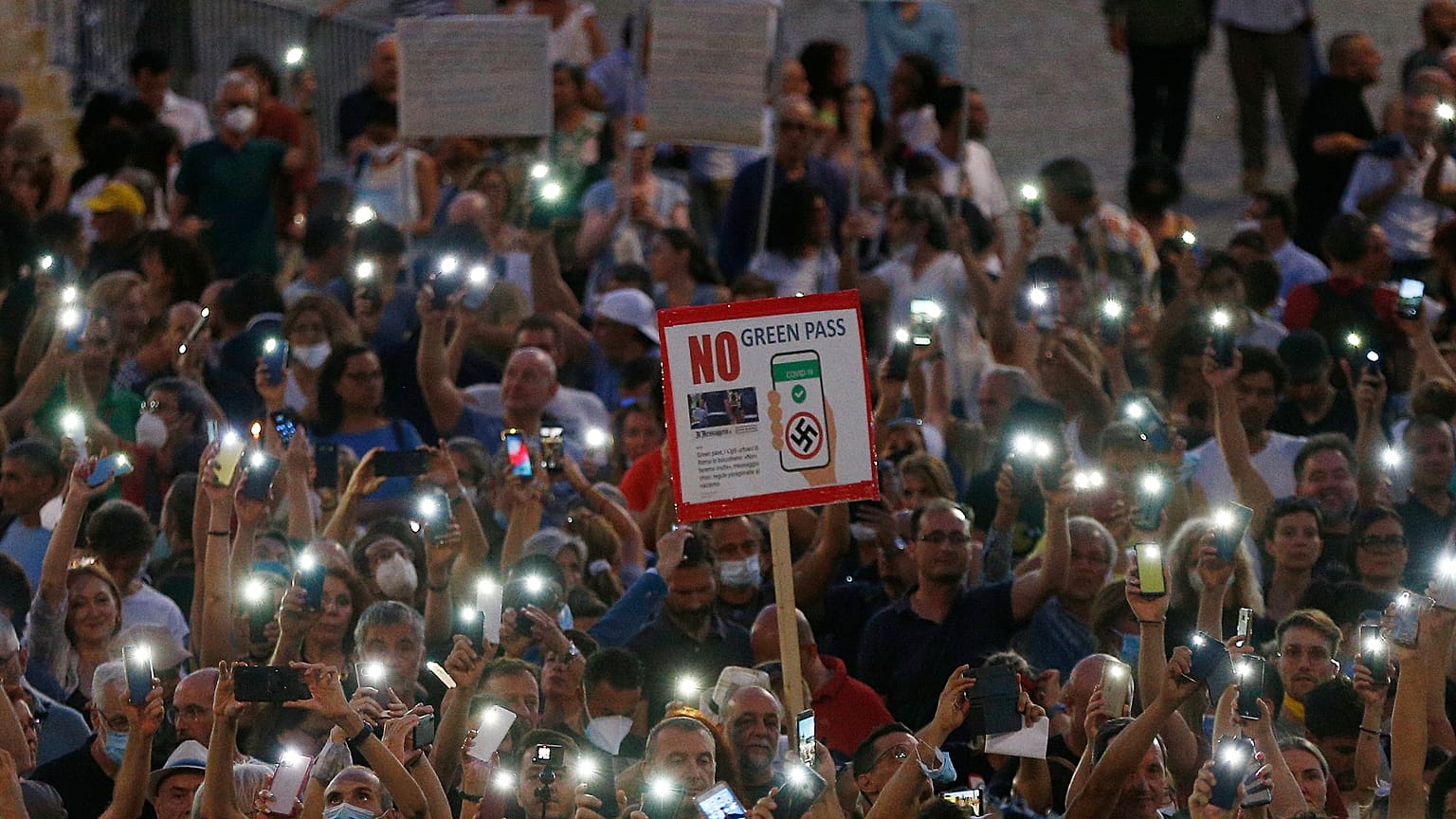 People stage a protest against the COVID-19 vaccination pass in Rome in July.