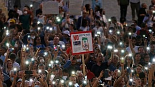 People stage a protest against the COVID-19 vaccination pass in Rome in July.