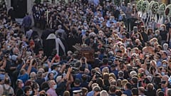 Pallbearers carry coffin of Greek composer Mikis Theodorakis outside the Metropolitan church, prior to his funeral service, in Chania, Crete island, Greece, September 9 2021