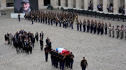 Republican Guards carry the coffin of Jean-Paul Belmondo after a tribute ceremony for the late French actor at the Hotel des Invalides.