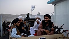 Taliban fighters sit in a pickup truck at the airport in Kabul, Afghanistan, Thursday, Sept. 9, 2021. 