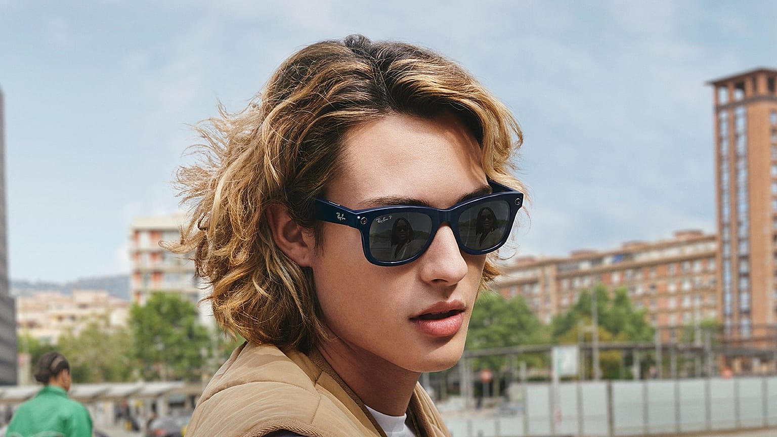 A woman models the new glasses made by Facebook and Ray Ban.