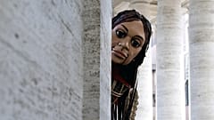 A giant puppet - called Little Amal - depicting a young Syrian refugee girl arrives at St. Peter's square in the Vatican.