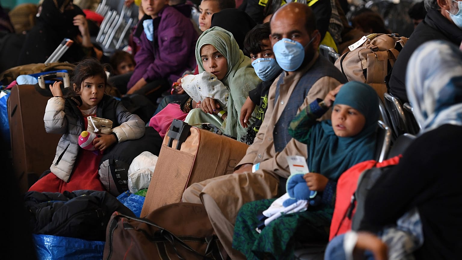Afghan refugees are processed inside Hangar 5 at the Ramstein U.S. Air Base in Germany Wednesday, Sept. 8, 2021. U.S.