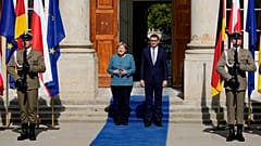 German Chancellor Angela Merkel, left, meets Poland's Prime Minister Mateusz Morawiecki in Warsaw, Poland, Saturday, Sept.11, 2021.