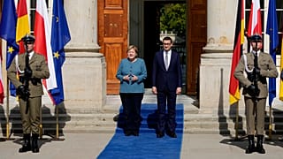 German Chancellor Angela Merkel, left, meets Poland's Prime Minister Mateusz Morawiecki in Warsaw, Poland, Saturday, Sept.11, 2021.