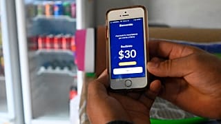 A person shows a screen while using the Salvadoran government's electronic wallet Chivo, after bitcoins were put into circulation throughout the country.