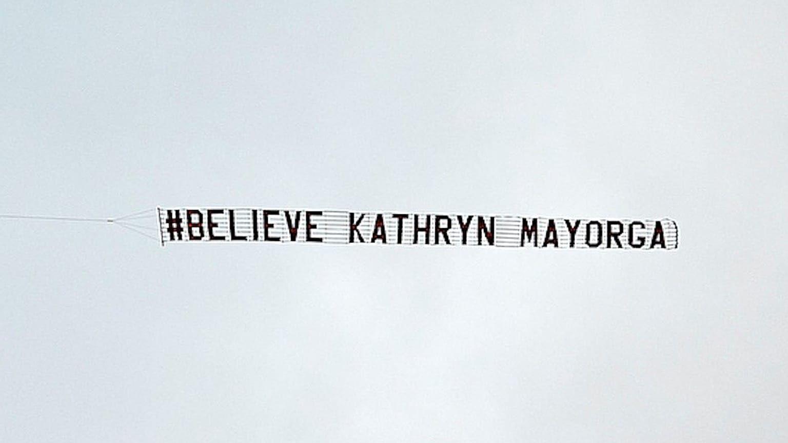 The banner, saying Believe Kathryn Mayorga, was flown over Manchester United's Old Trafford stadium.